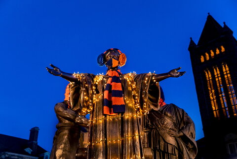 Alma Mater is all ready for the cold weather with a winter scarf, ear muffs and holiday lights. Her garb is completed with a mask during this era of COVID-19.