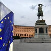 Picture of a Vienna courtyard and statue with the EU flag