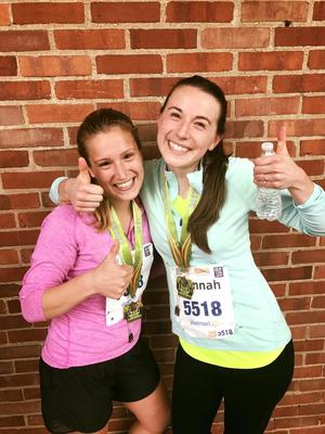 picture of author and friend smiling showing off their marathon medals