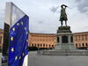Picture of a Vienna courtyard and statue with the EU flag