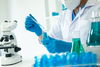 chemist using chemicals in lab