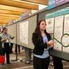 Alayna Johnson presenting a research poster