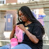 Illini student relaxes by crocheting near the Illini Union.